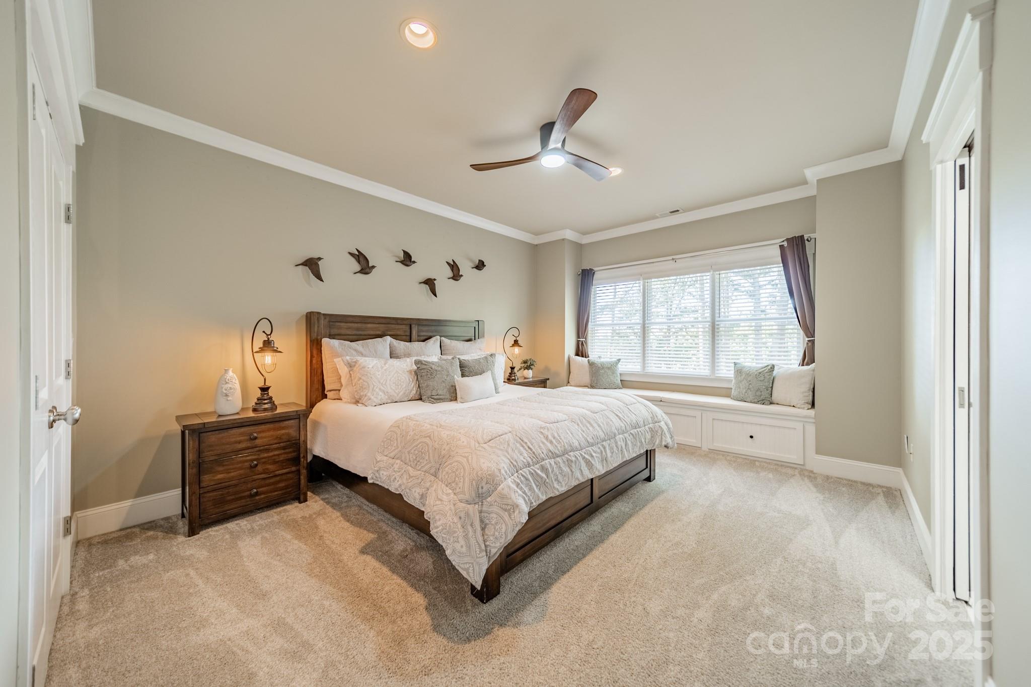 1946 Brawley School Road Mooresville, NC 28117 - Photo 31 of 48 a spacious bedroom with a bed and a window