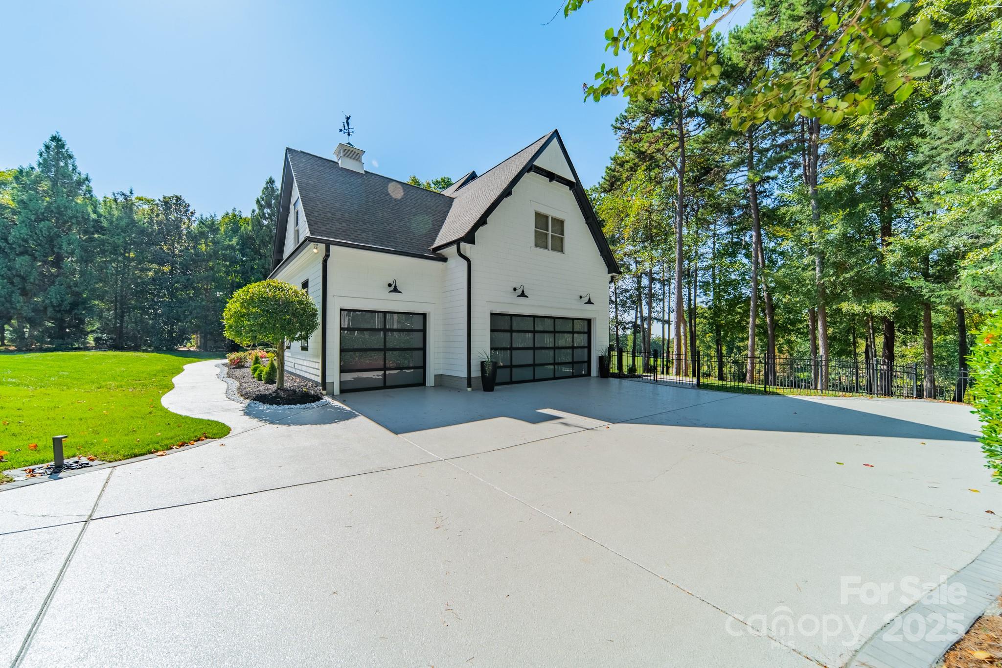1946 Brawley School Road Mooresville, NC 28117 - Photo 5 of 48 a view of a house with backyard and a tree