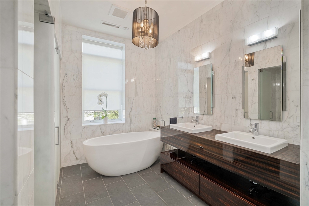 232 Summit Avenue, Unit A5 Brookline, MA 02446 - Photo 14 of 21 a spacious bathroom with a bathtub and sink
