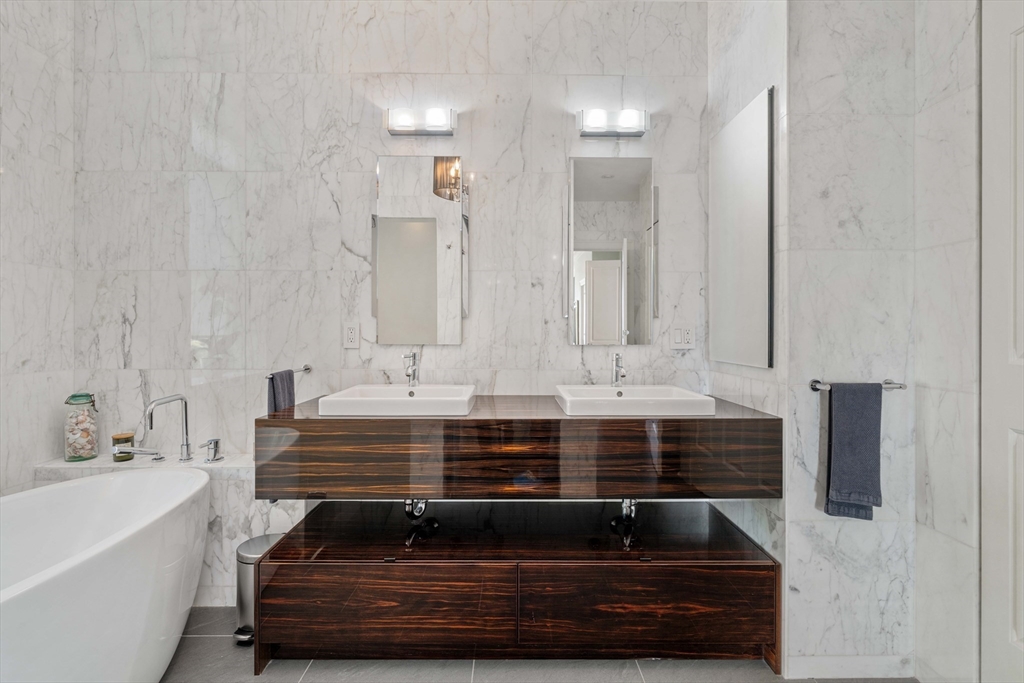 232 Summit Avenue, Unit A5 Brookline, MA 02446 - Photo 15 of 21 a bathroom with a sink and a mirror