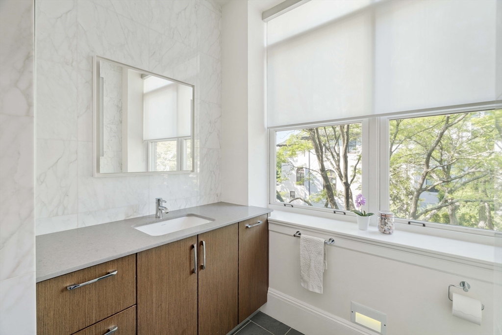 232 Summit Avenue, Unit A5 Brookline, MA 02446 - Photo 18 of 21 a kitchen with a sink and large window