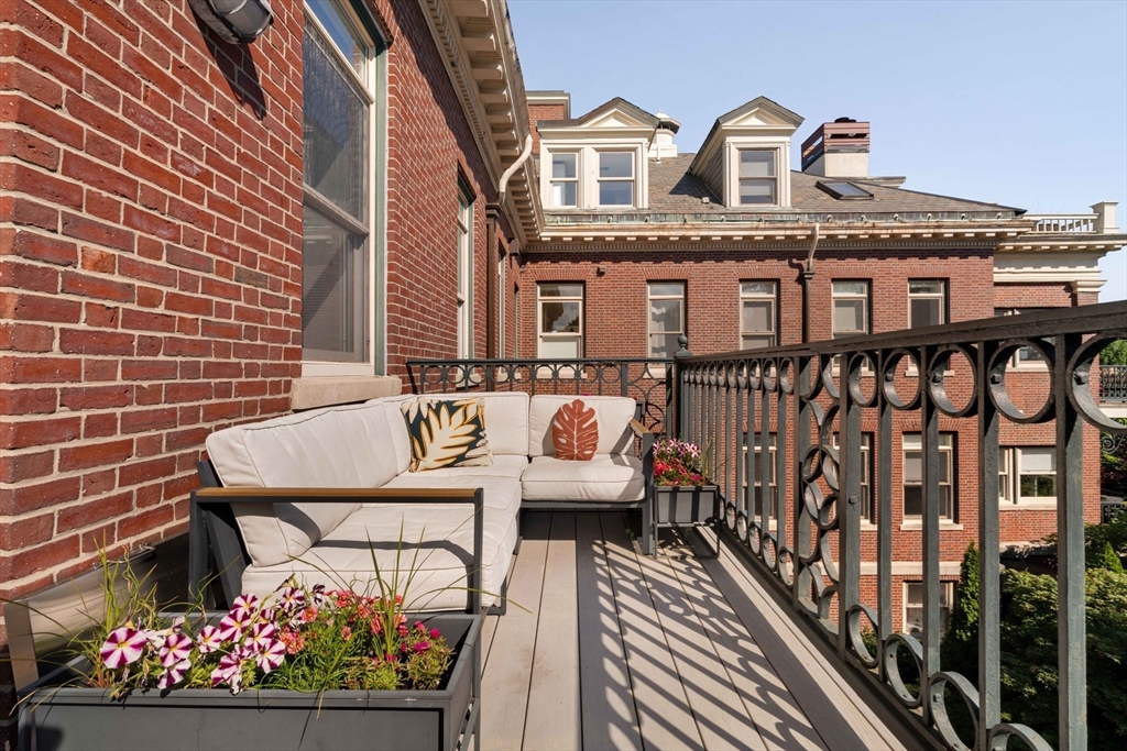 232 Summit Avenue, Unit A5 Brookline, MA 02446 - Photo 20 of 21 a front view of a house with a garden