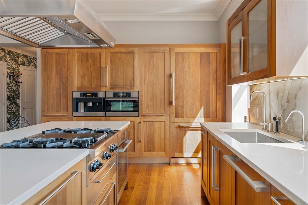 232 Summit Avenue, Unit A5 Brookline, MA 02446 - Photo 4 of 21 a kitchen with stainless steel appliances a stove a sink and a refrigerator