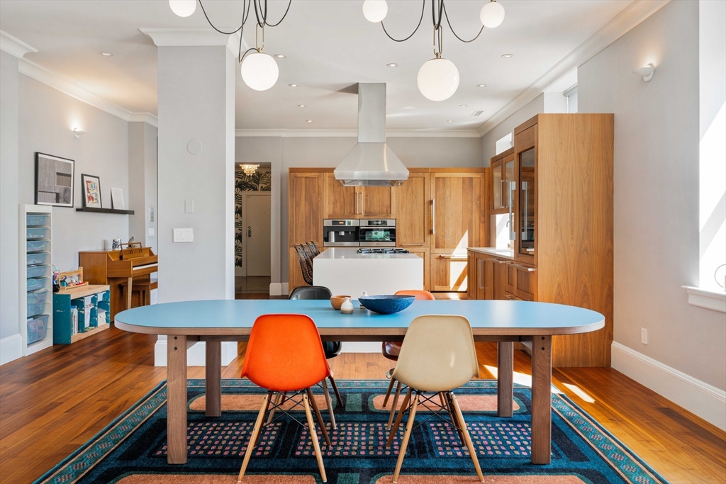 232 Summit Avenue, Unit A5 Brookline, MA 02446 - Photo 6 of 21 a view of a dining room with furniture and wooden floor