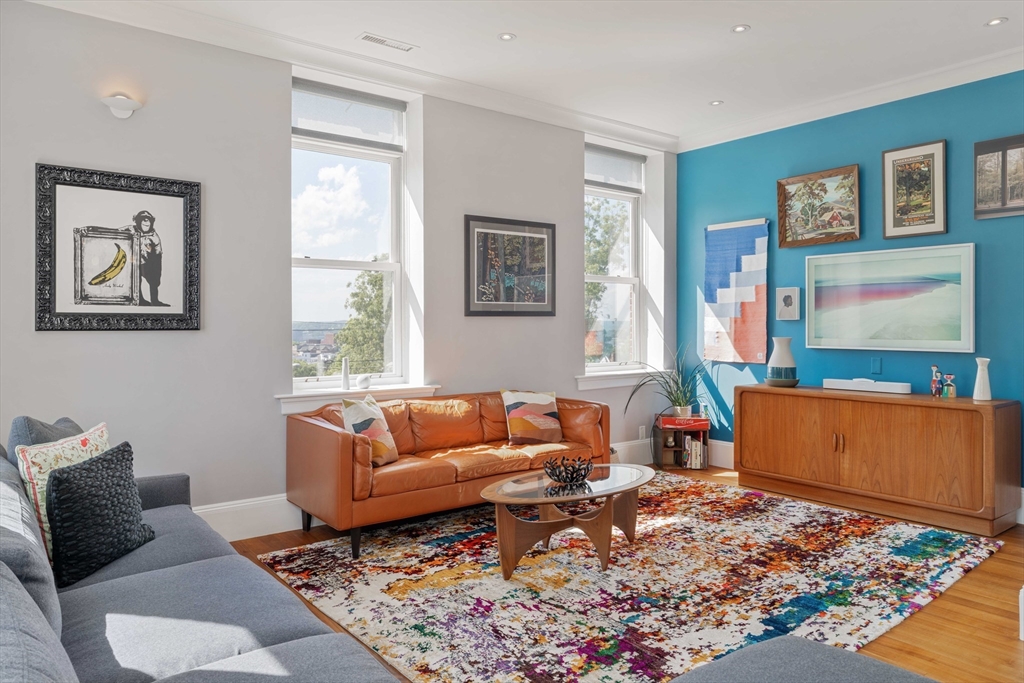 232 Summit Avenue, Unit A5 Brookline, MA 02446 - Photo 8 of 21 a living room with furniture and a flat screen tv