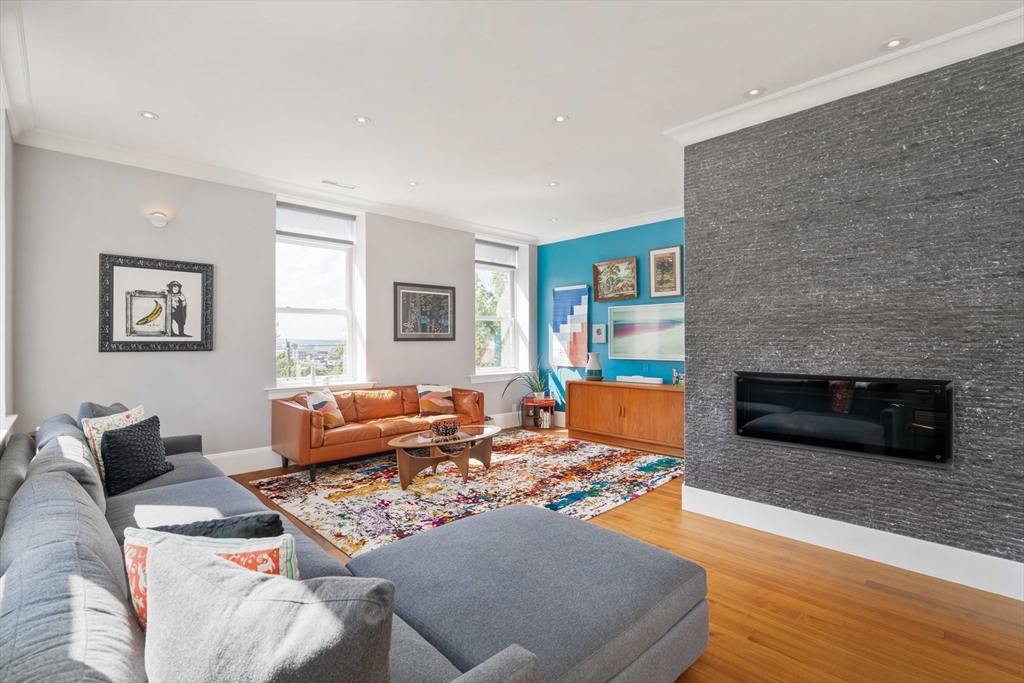232 Summit Avenue, Unit A5 Brookline, MA 02446 - Photo 9 of 21 a living room with furniture and a fireplace