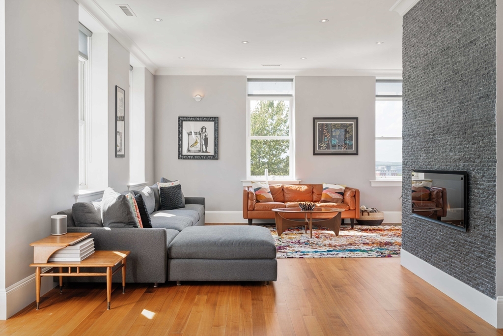 232 Summit Avenue, Unit A5 Brookline, MA 02446 - Photo 10 of 21 a living room with furniture and a fireplace