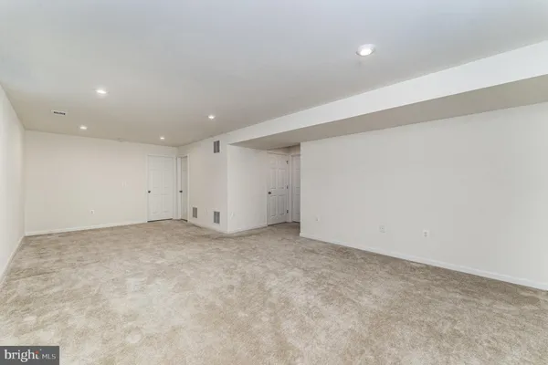 a view of a garden with a house