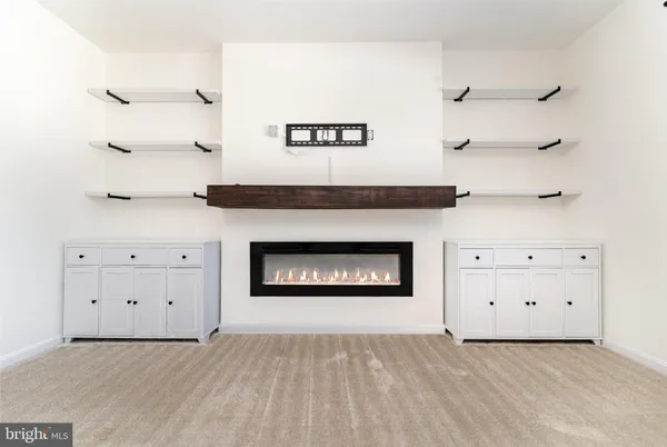 a view of a livingroom with washer and dryer
