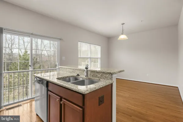 a kitchen that has a sink and a window