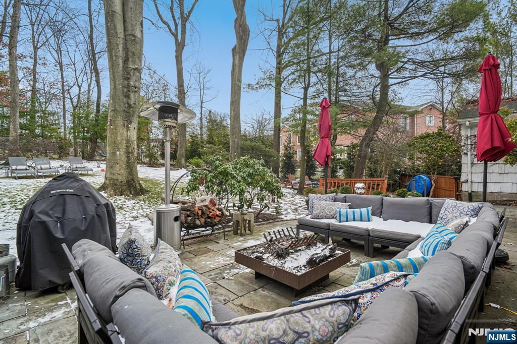 395 Highview Road Englewood, NJ 07631 - Photo 12 of 13 a view of a patio with couches and a fire pit