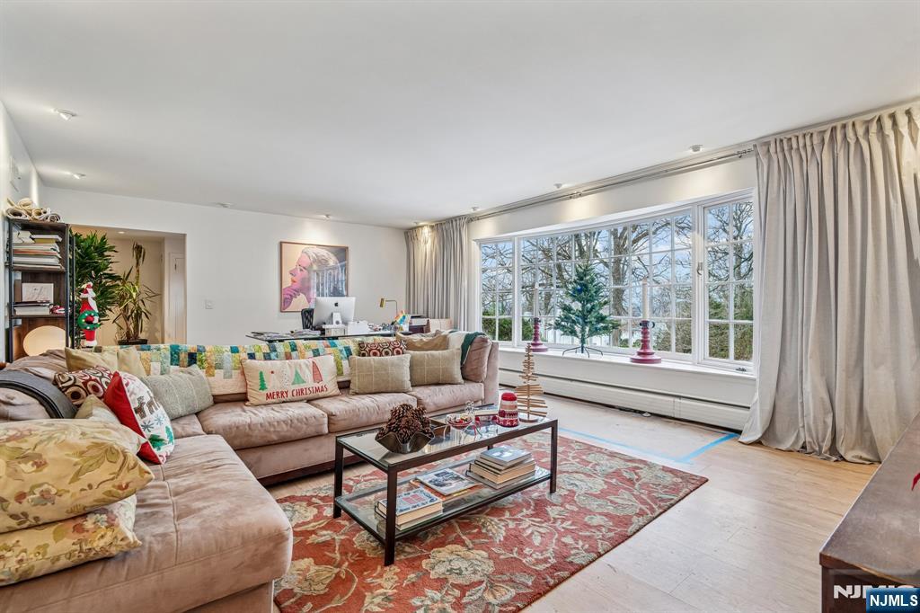 395 Highview Road Englewood, NJ 07631 - Photo 3 of 13 a living room with furniture and a large window