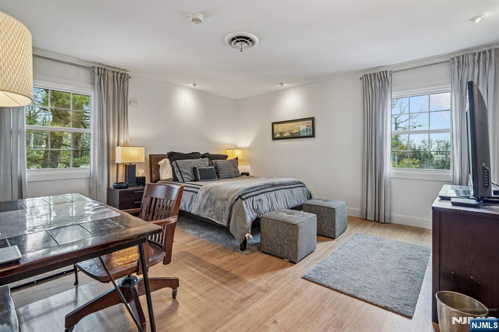 395 Highview Road Englewood, NJ 07631 - Photo 5 of 13 a bedroom with furniture and a window