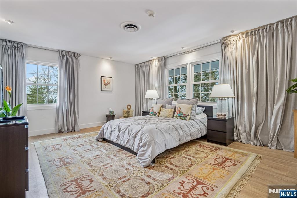 395 Highview Road Englewood, NJ 07631 - Photo 6 of 13 a bedroom with a large bed and a window