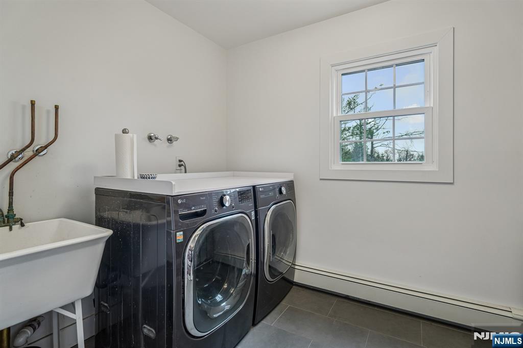 395 Highview Road Englewood, NJ 07631 - Photo 10 of 13 a utility room with dryer and washer