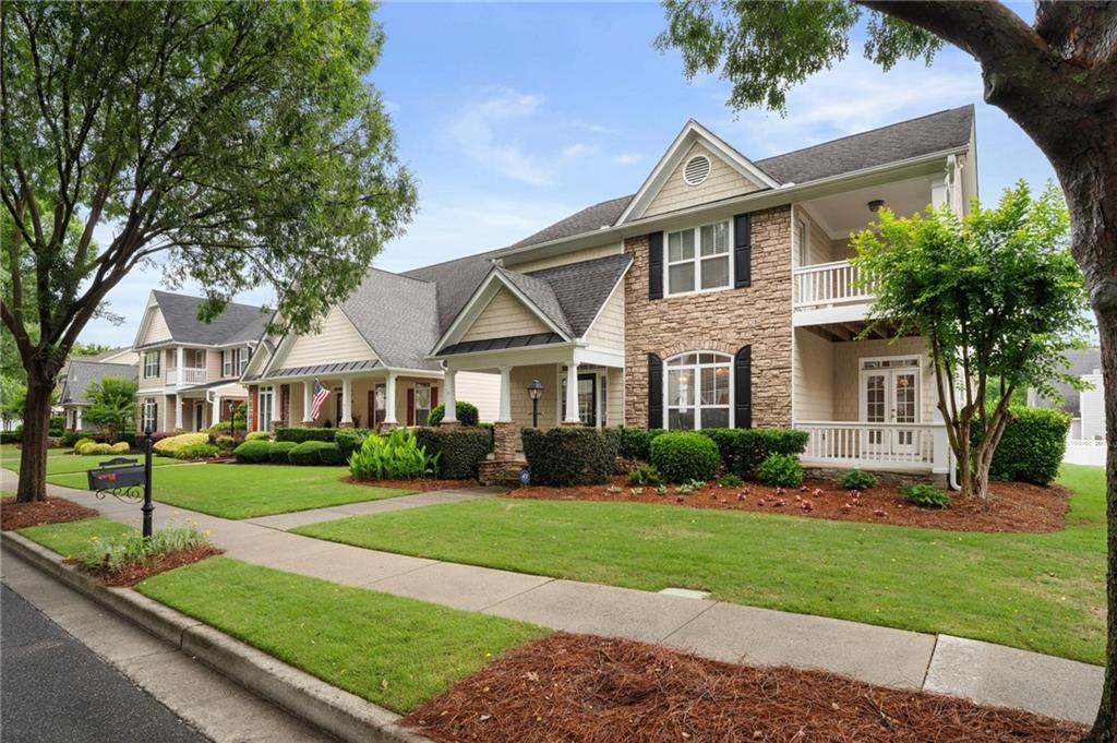 878 Scales Road Suwanee, GA 30024 - Photo 2 of 17 a front view of a house with a yard