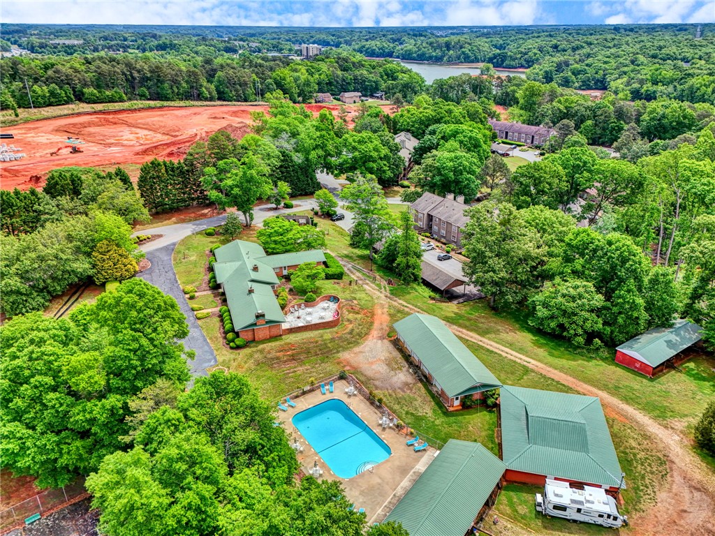 104 Captains Way Anderson, SC 29625 - Photo 16 of 47 An aerial perspective reveals a serene estate with lush greenery and distant lake views.