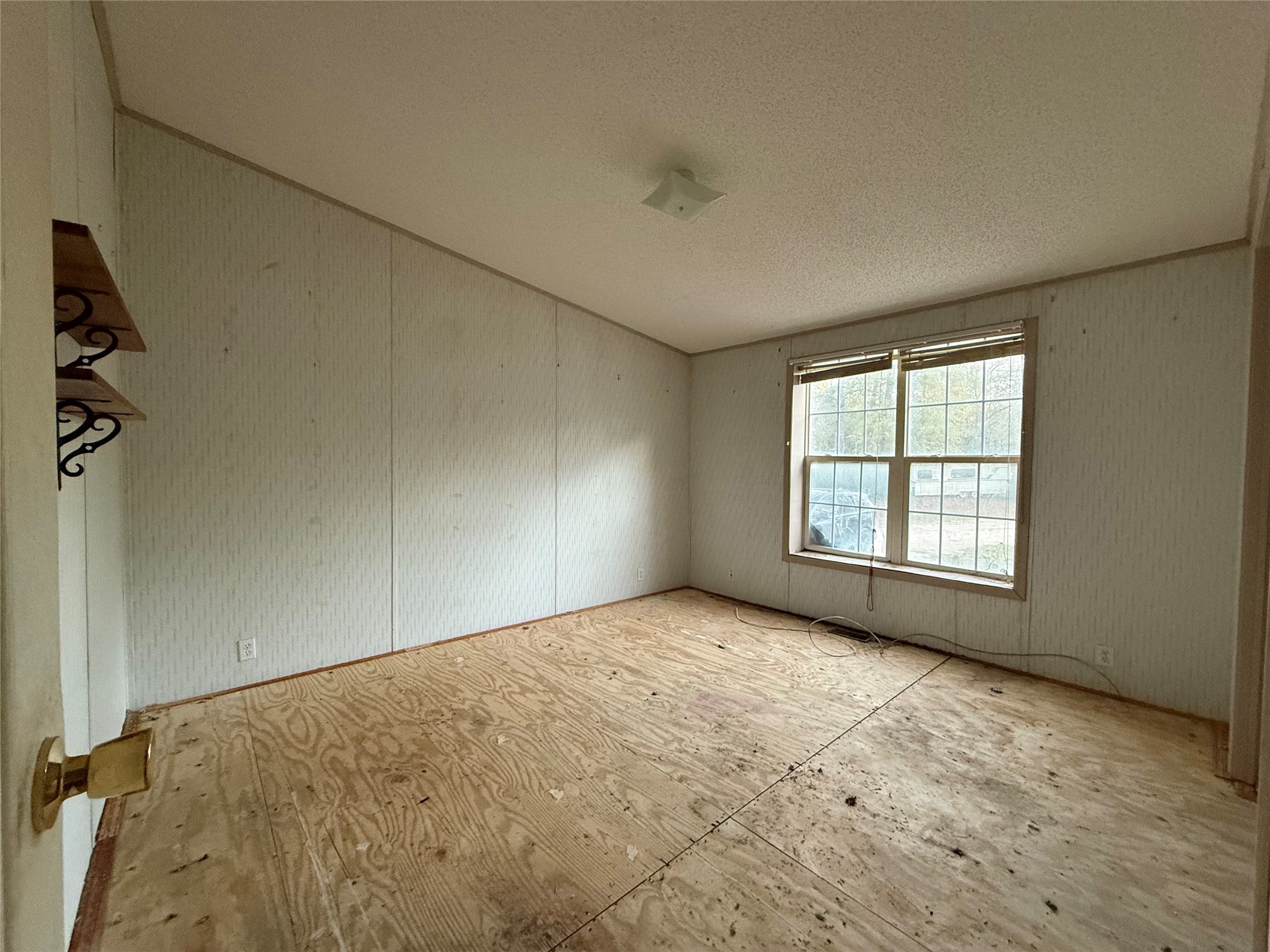 669 County Road 1245 Warren, TX 77664 - Photo 11 of 28 an empty room with windows