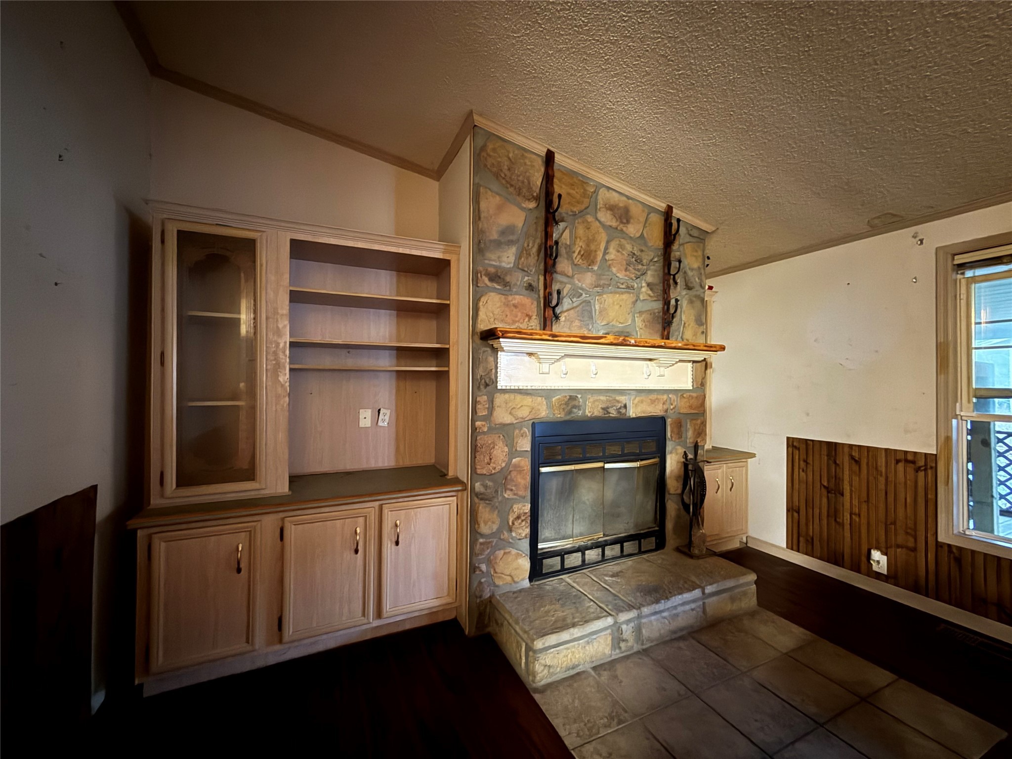 669 County Road 1245 Warren, TX 77664 - Photo 16 of 28 a living room with furniture and a fireplace