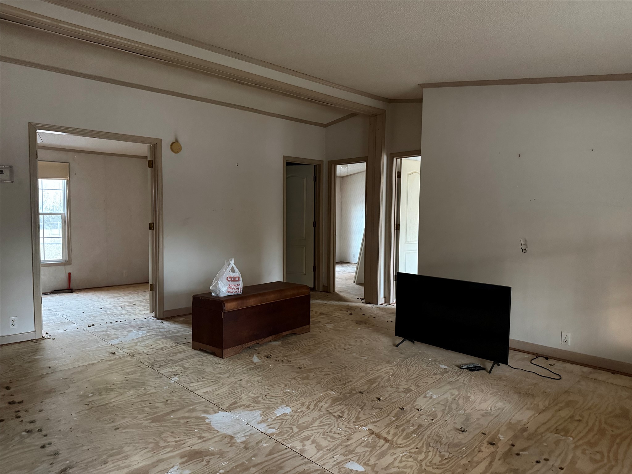 669 County Road 1245 Warren, TX 77664 - Photo 18 of 28 a living room with a couch and a dresser next to a window