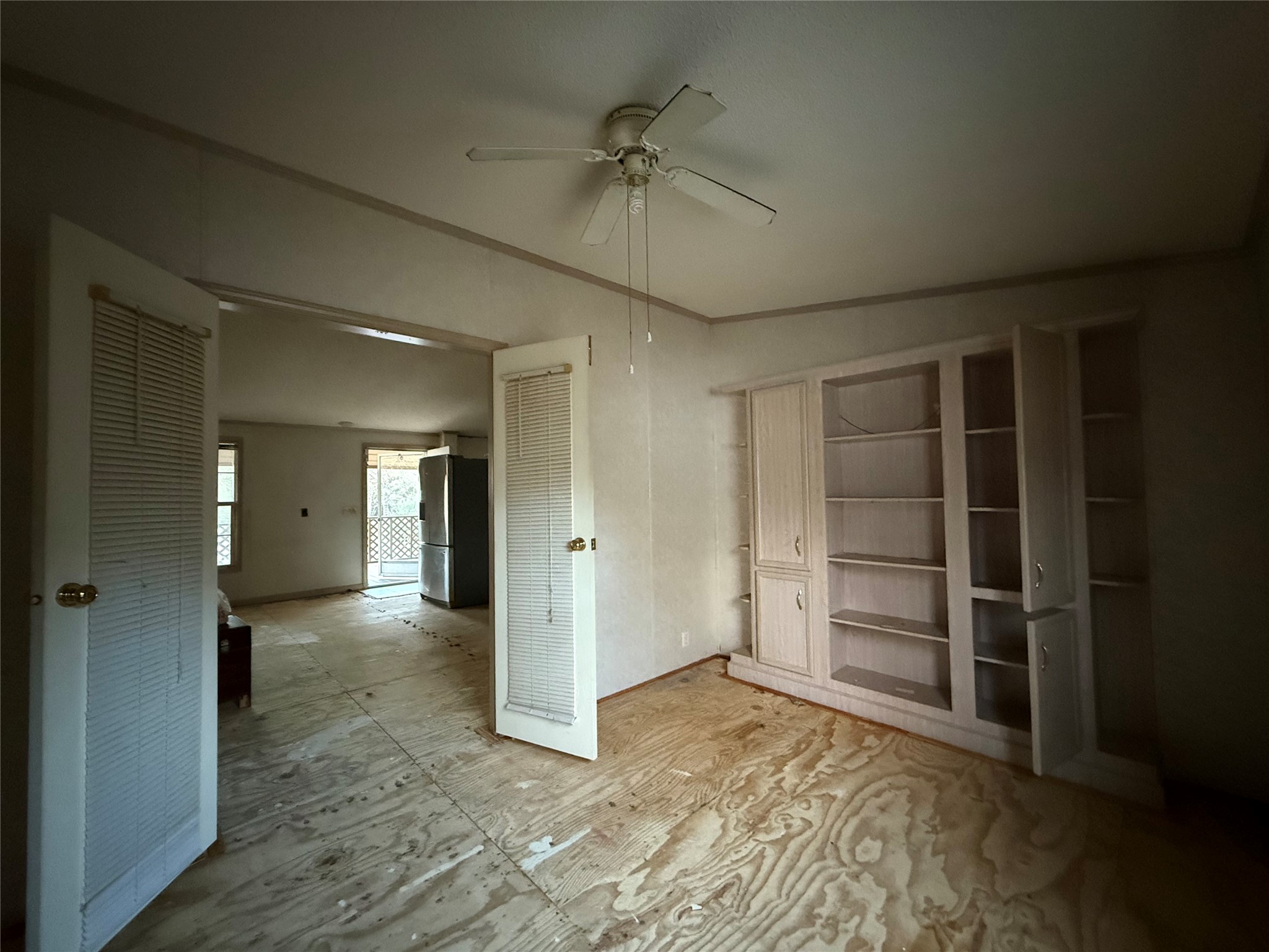669 County Road 1245 Warren, TX 77664 - Photo 19 of 28 wooden floor in an empty room and a bathroom