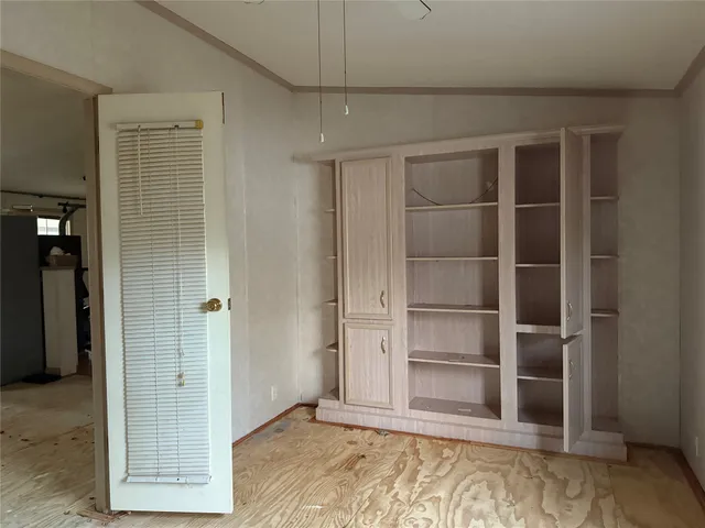 a kitchen with stainless steel appliances a refrigerator and a stove top oven