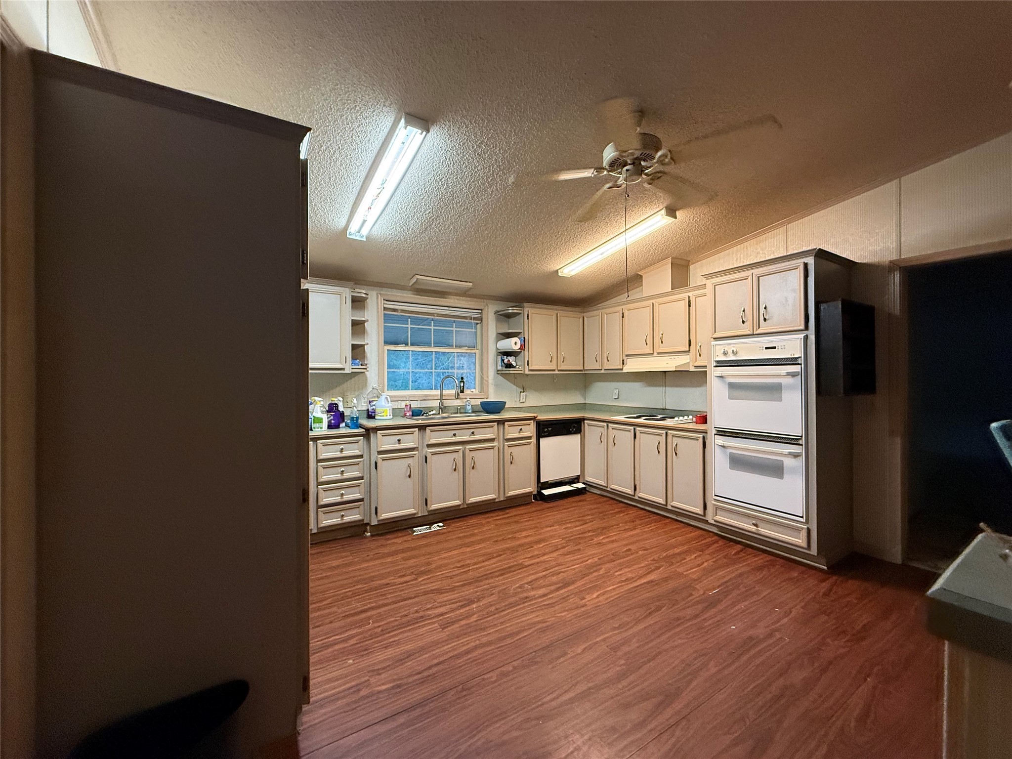 669 County Road 1245 Warren, TX 77664 - Photo 21 of 28 a kitchen with stainless steel appliances a refrigerator and a stove top oven