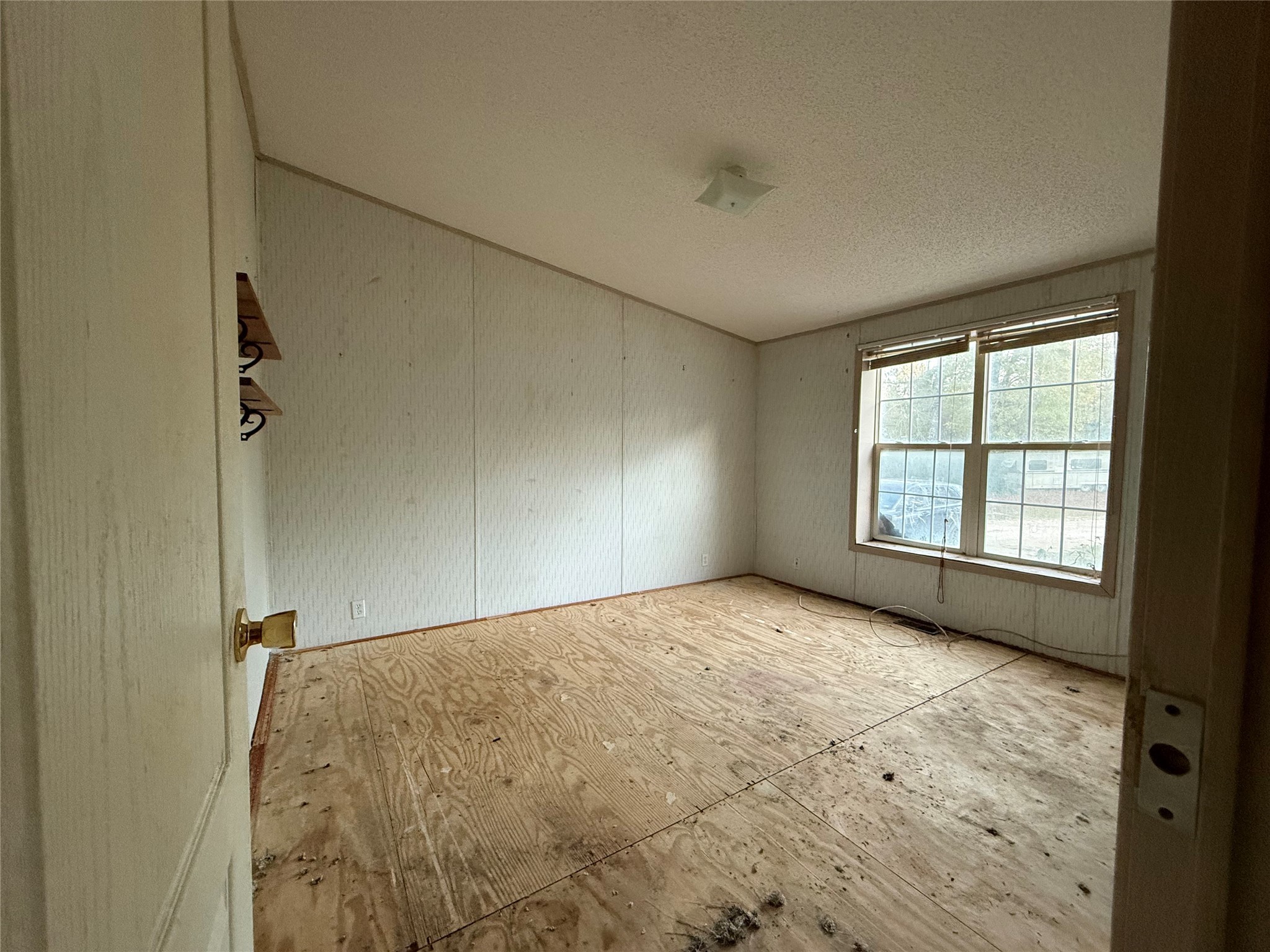 669 County Road 1245 Warren, TX 77664 - Photo 22 of 28 a view of empty room with window