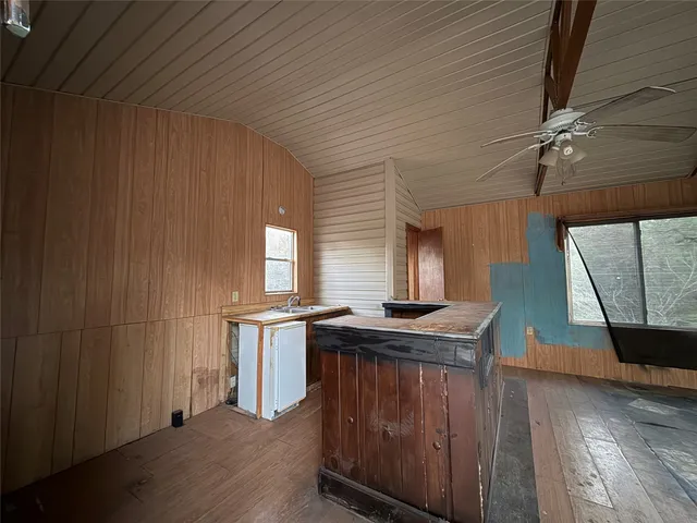 a view of a room with a ceiling fan