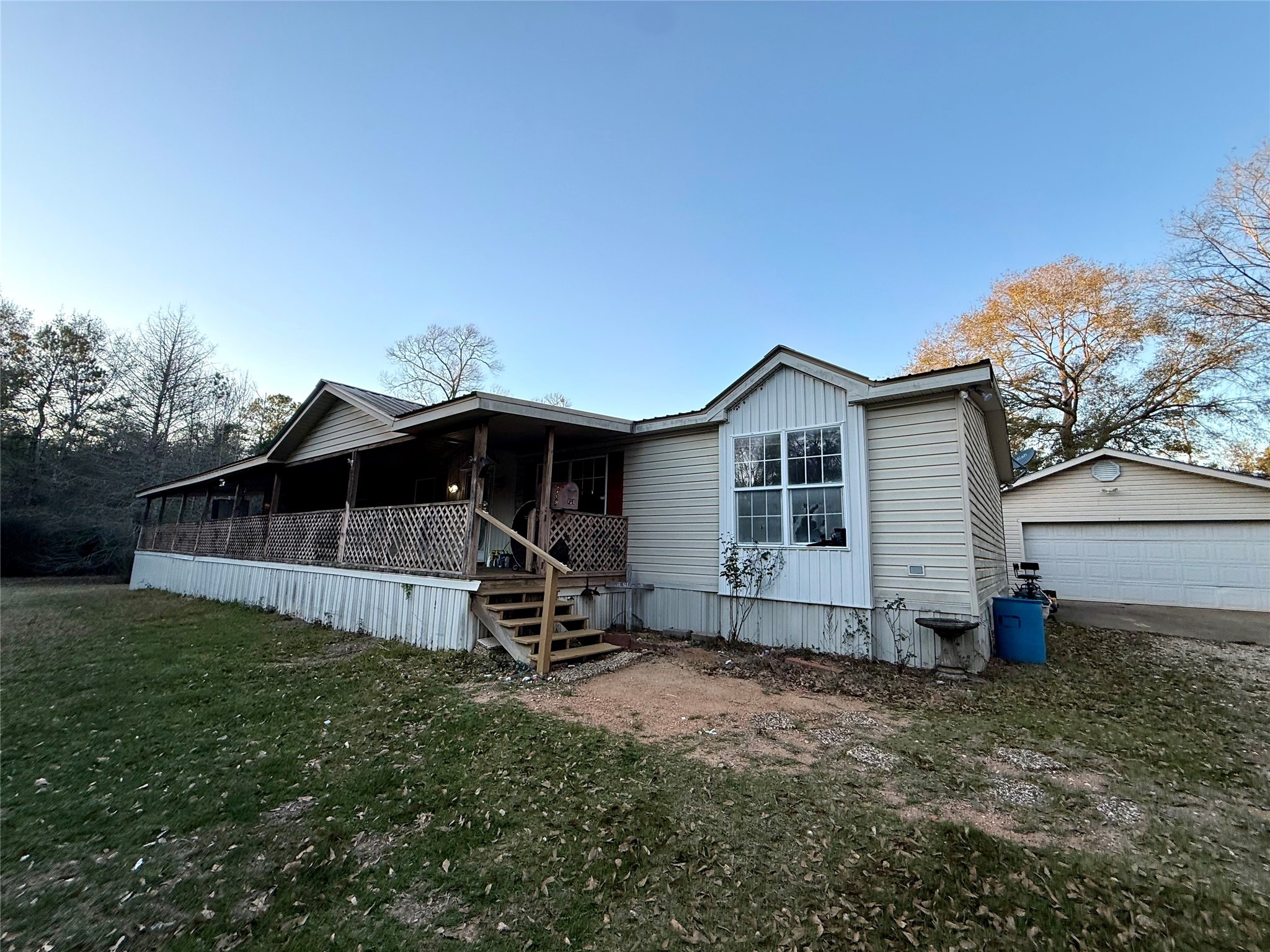 669 County Road 1245 Warren, TX 77664 - Photo 4 of 28 a view of a house with backyard