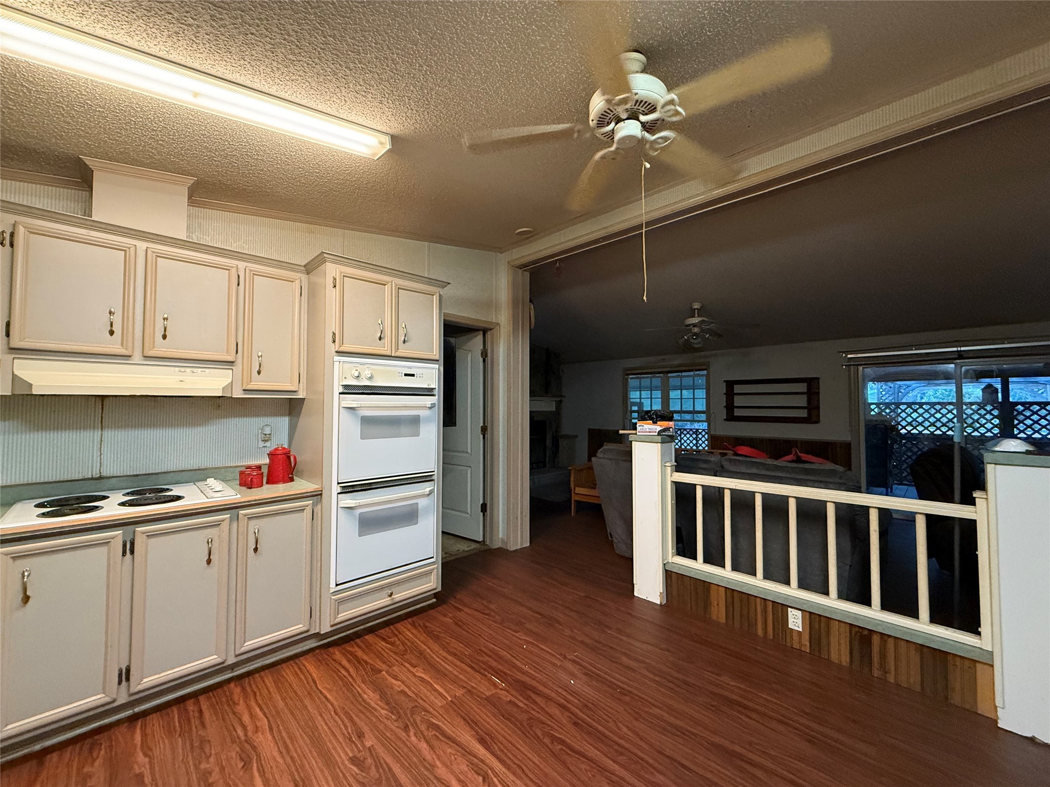 669 County Road 1245 Warren, TX 77664 - Photo 8 of 28 a view of a kitchen with wooden floor and electronic appliances