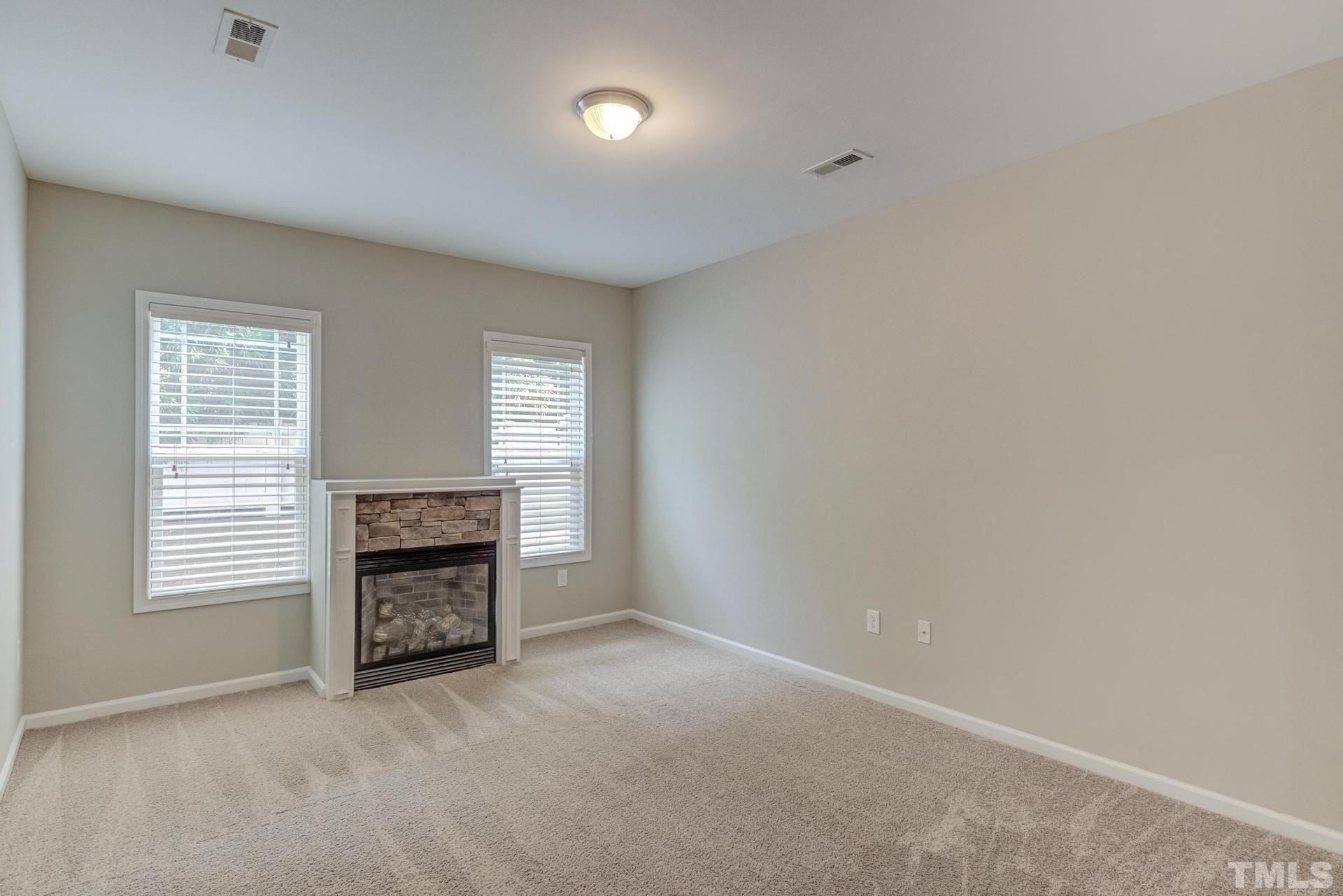6307 Yates Mill Pond Road Raleigh, NC 27606 - Photo 15 of 41 Main level owner's suite w/fireplace!