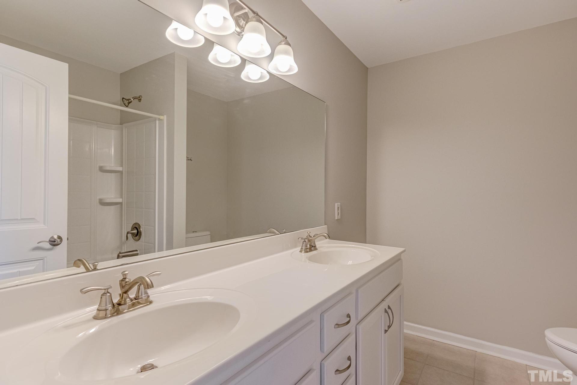 6307 Yates Mill Pond Road Raleigh, NC 27606 - Photo 30 of 41 Full hall bathroom on second level.