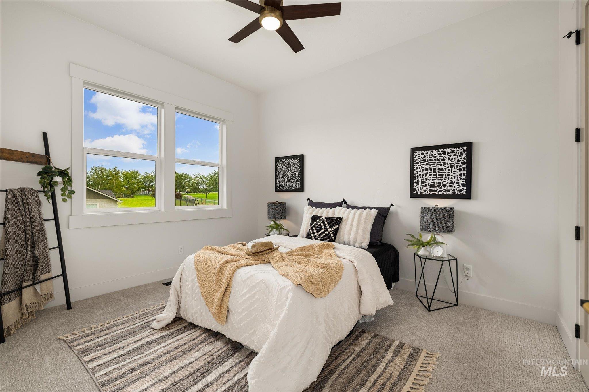 22909 Cirrus Vw Court Caldwell, ID 83607 - Photo 36 of 50 Bedroom with light colored carpet and ceiling fan