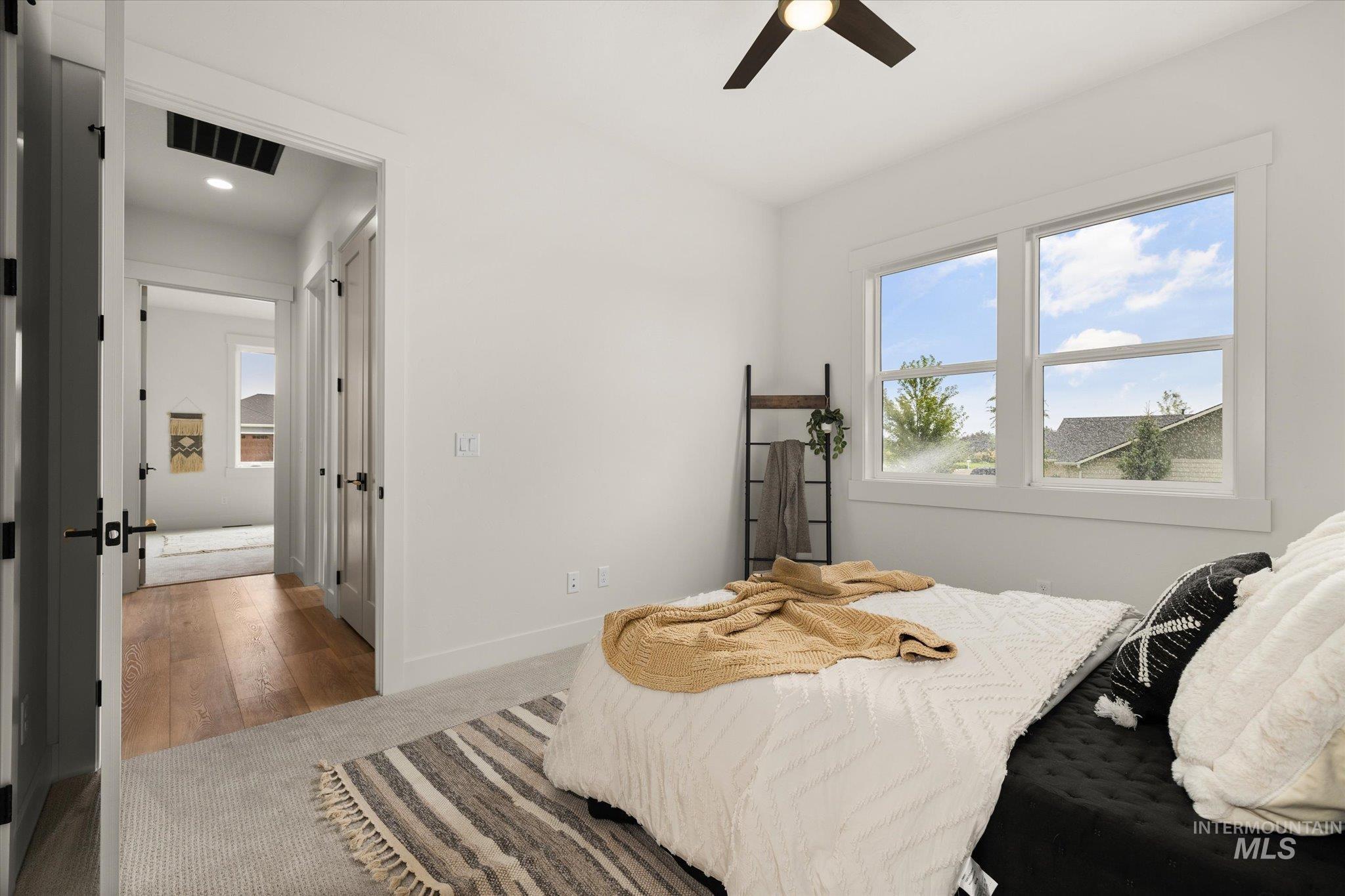 22909 Cirrus Vw Court Caldwell, ID 83607 - Photo 37 of 50 Carpeted bedroom featuring multiple windows and ceiling fan