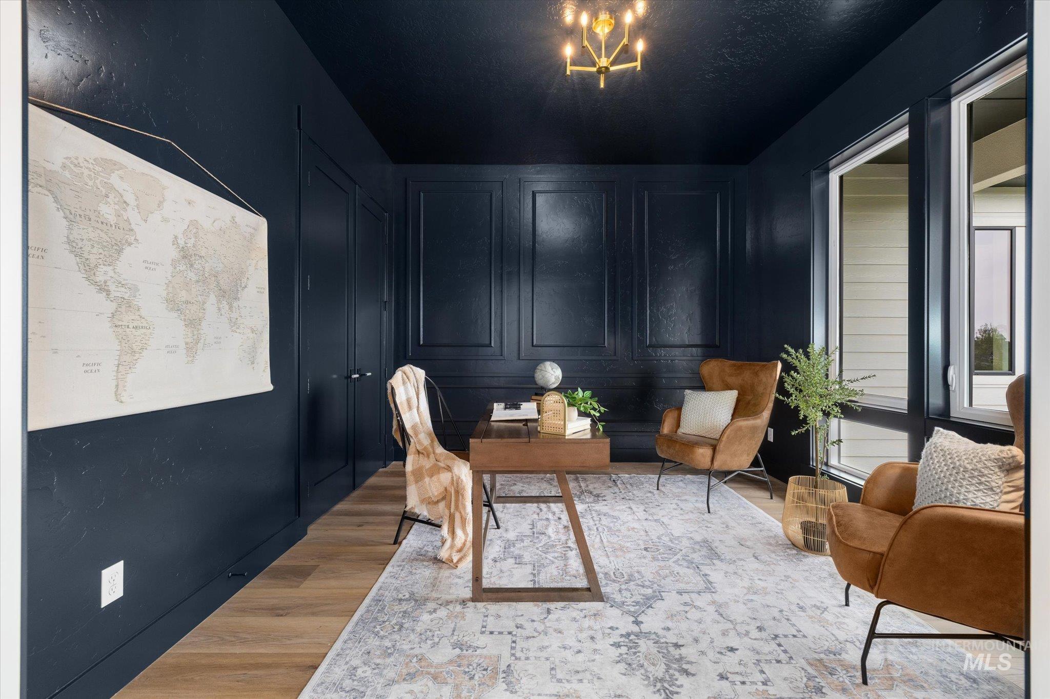 22909 Cirrus Vw Court Caldwell, ID 83607 - Photo 40 of 50 Home office with wood finished floors, a decorative wall, and a chandelier