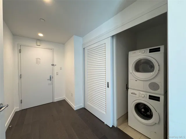 a view of a hallway with washer and dryer