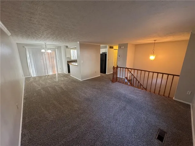 a view of a hallway with windows