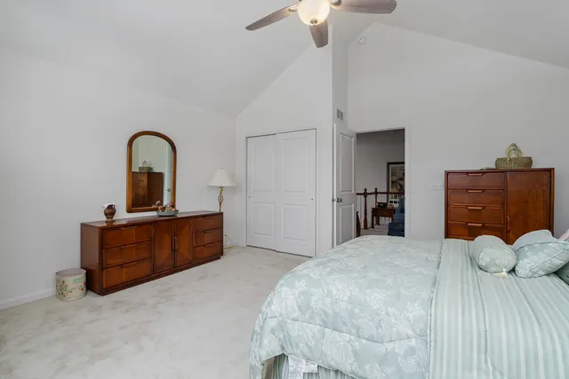 a bedroom with a bed and a dresser