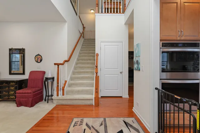 a view of room with furniture and wooden floor