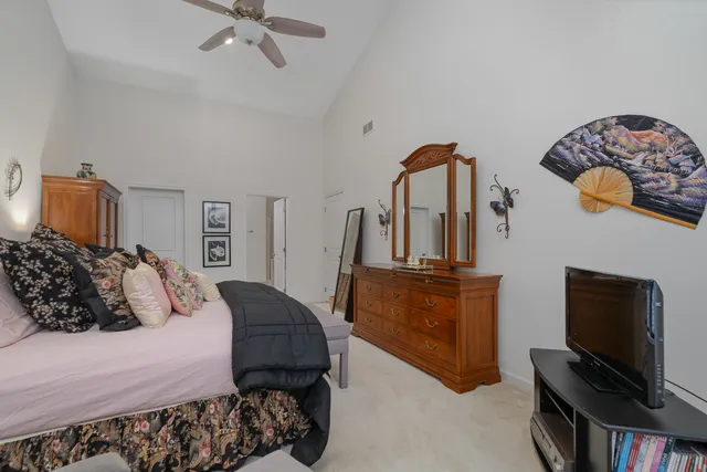 a bedroom with a bed and a television in it