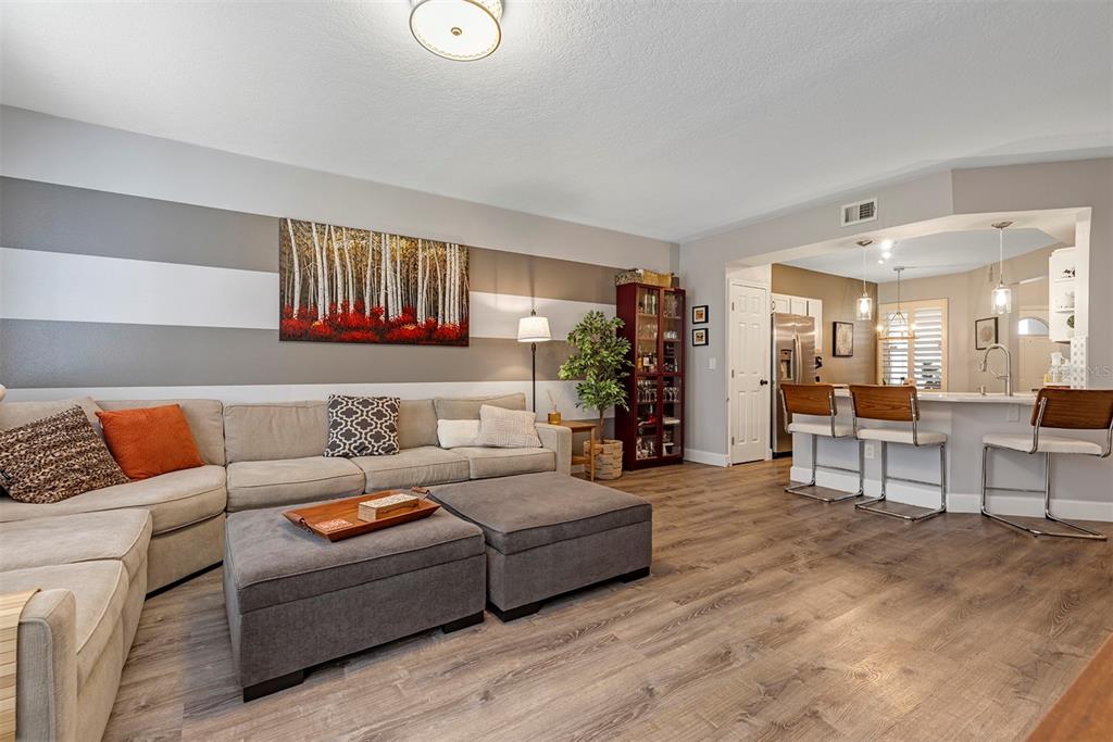 550 Cranes Way, Unit 120 Altamonte Springs, FL 32701 - Photo 11 of 32 a living room with furniture and a wooden floor