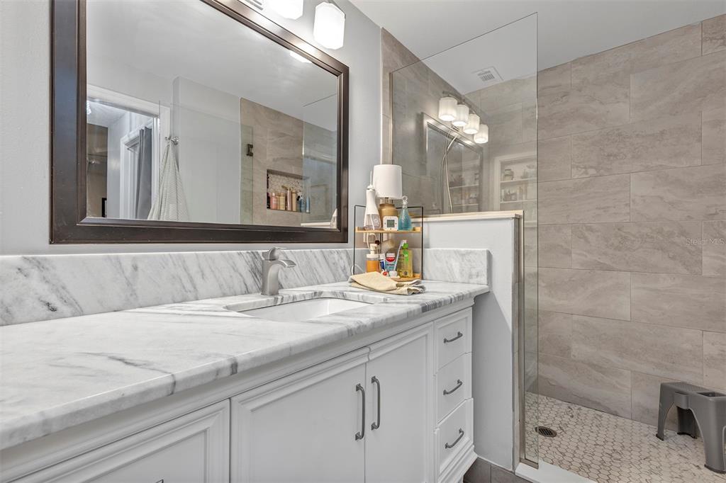 550 Cranes Way, Unit 120 Altamonte Springs, FL 32701 - Photo 14 of 32 a bathroom with a sink and a mirror