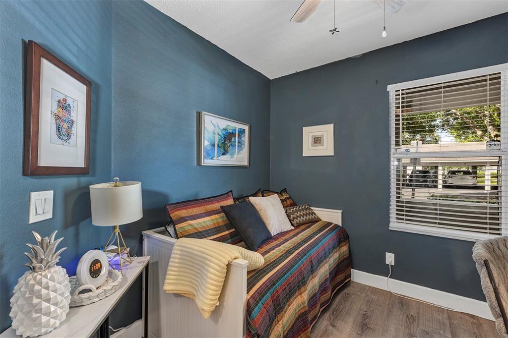 550 Cranes Way, Unit 120 Altamonte Springs, FL 32701 - Photo 19 of 32 a bedroom with a bed and wooden floor