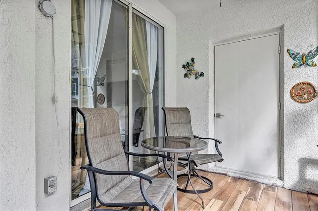 a living room with patio furniture