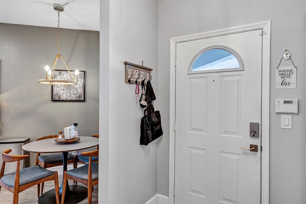 550 Cranes Way, Unit 120 Altamonte Springs, FL 32701 - Photo 2 of 32 a room that has a table and chairs in it