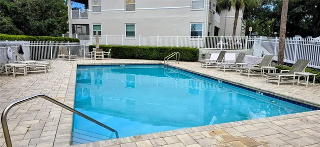 a view of a patio with swimming pool