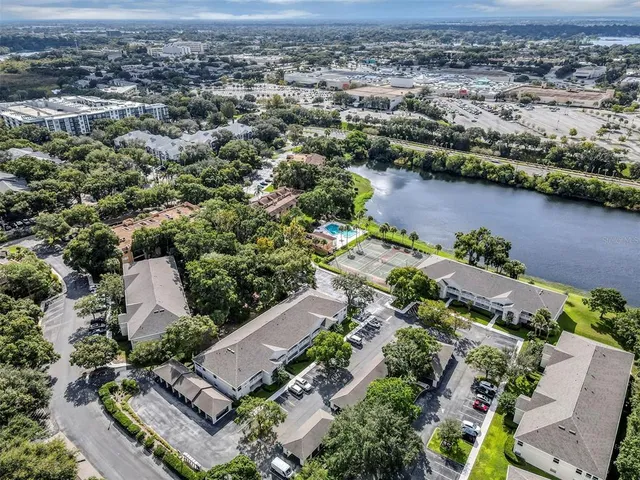 an aerial view of a city with lake view