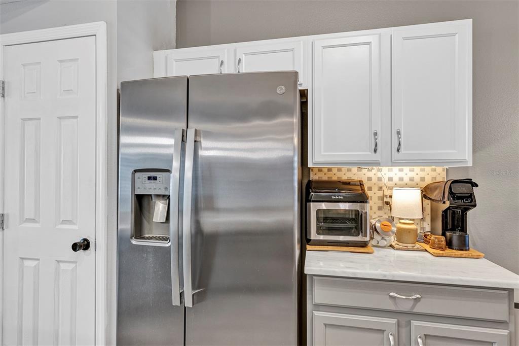 550 Cranes Way, Unit 120 Altamonte Springs, FL 32701 - Photo 6 of 32 a kitchen with a refrigerator and cabinets