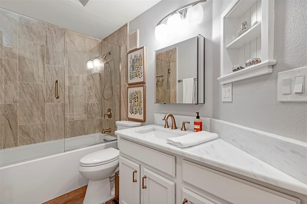 550 Cranes Way, Unit 120 Altamonte Springs, FL 32701 - Photo 8 of 32 a bathroom with a sink a toilet and shower